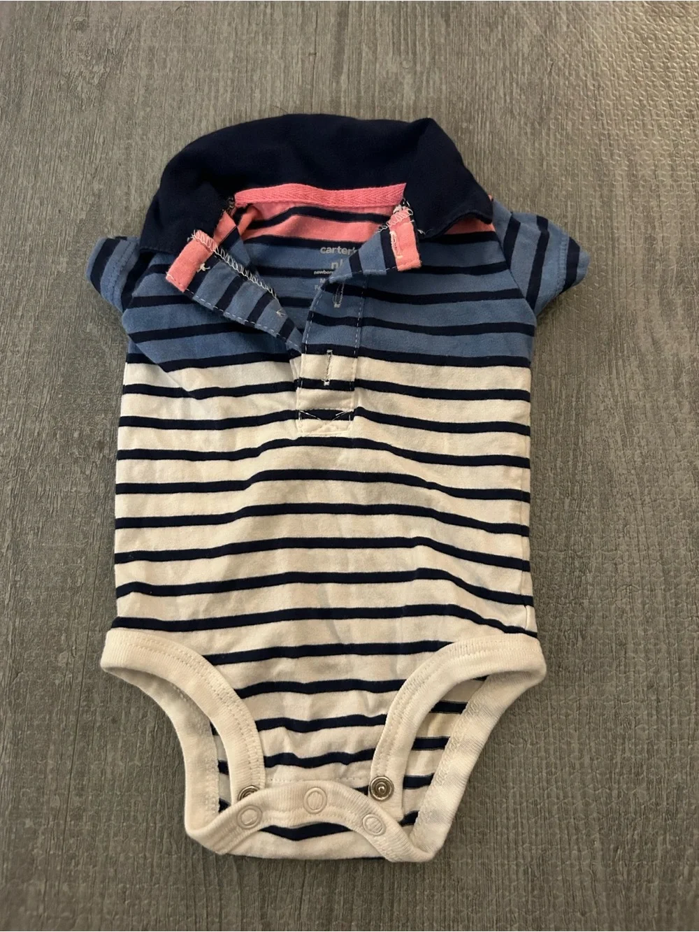 3 New born baby Carter's polo style shirts. (2 are onesies, & 1 is a shirt)
